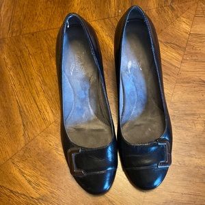 Black, round toe leather pump. Size 8.